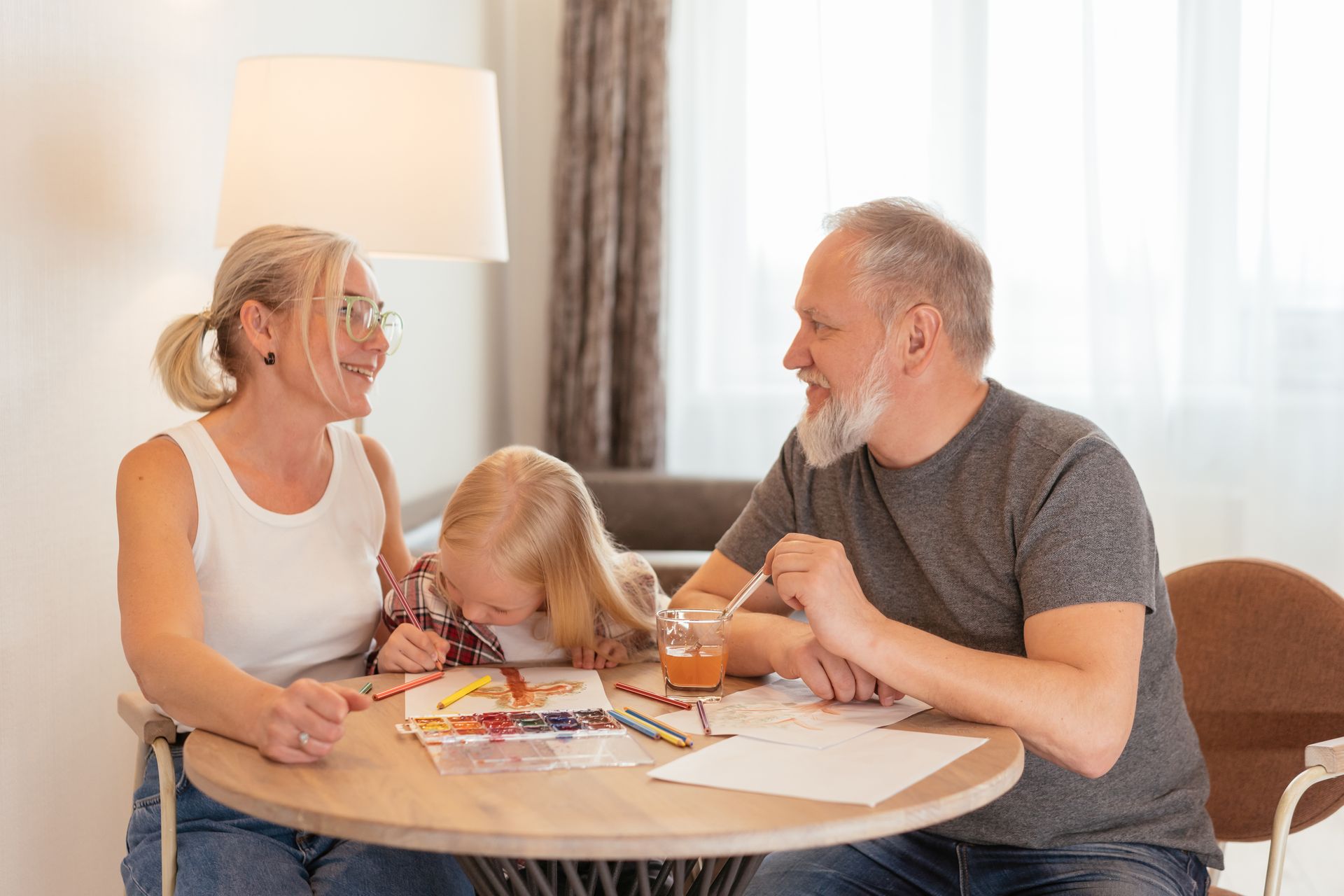 A family reviewing paperwork together at home