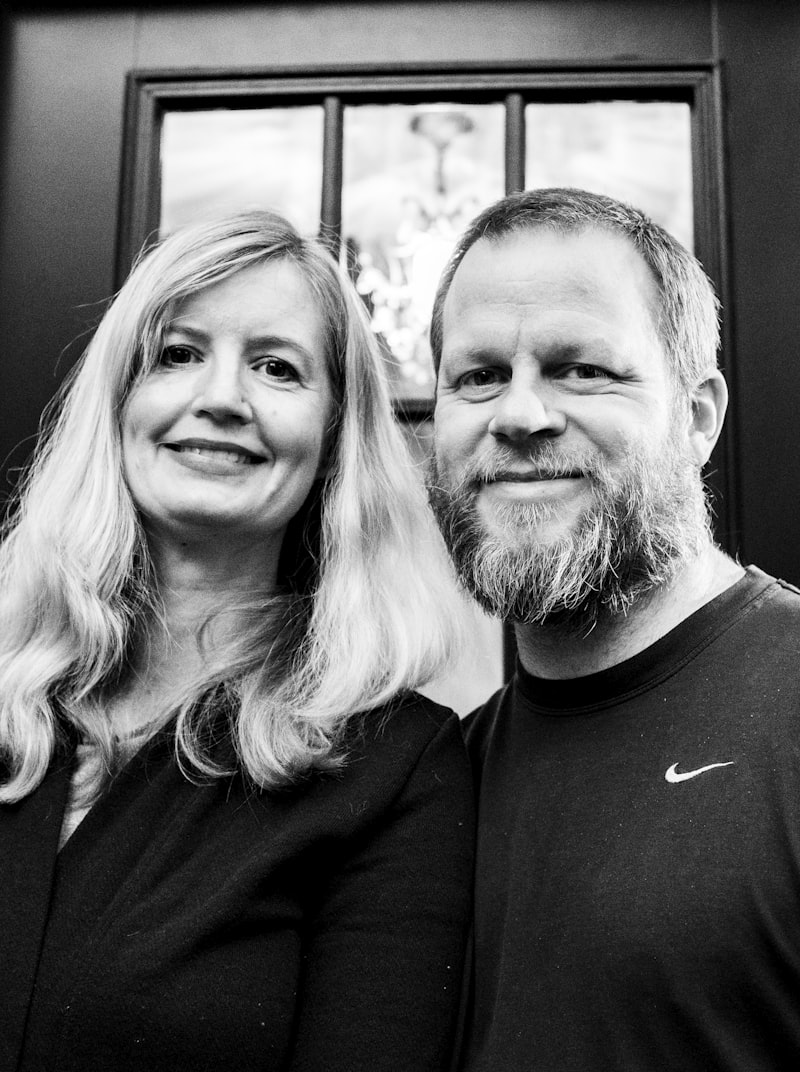 A smiling middle-aged couple together outdoors